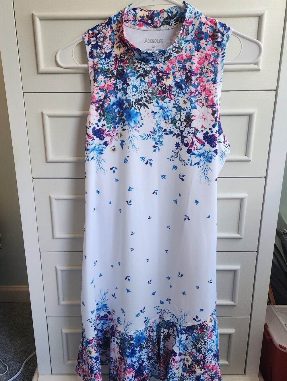 NWT AceGolfs Sports Dress. White With Bright Floral Pattern. Size M.